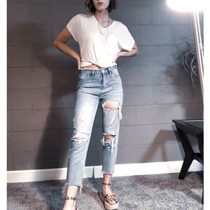 Distressed high-waisted denim jeans